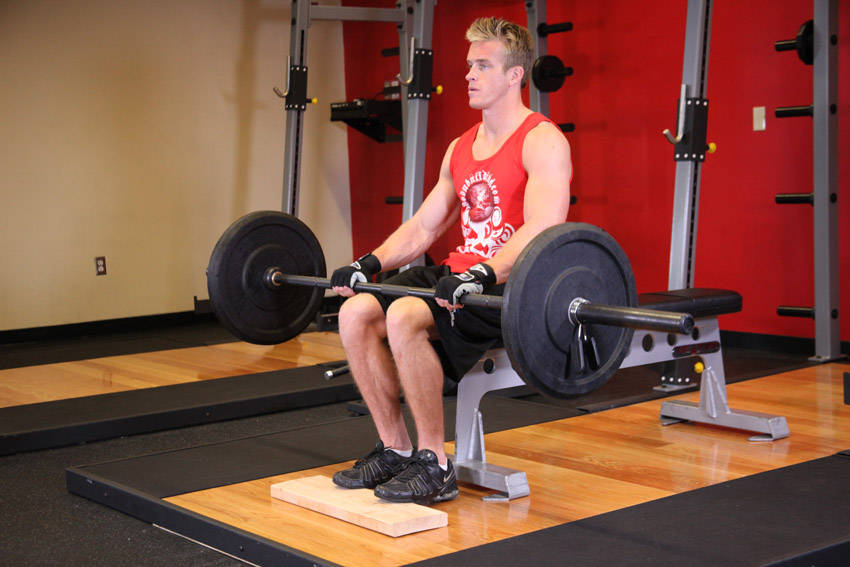 Barbell Seated Calf Raise: uitvoering